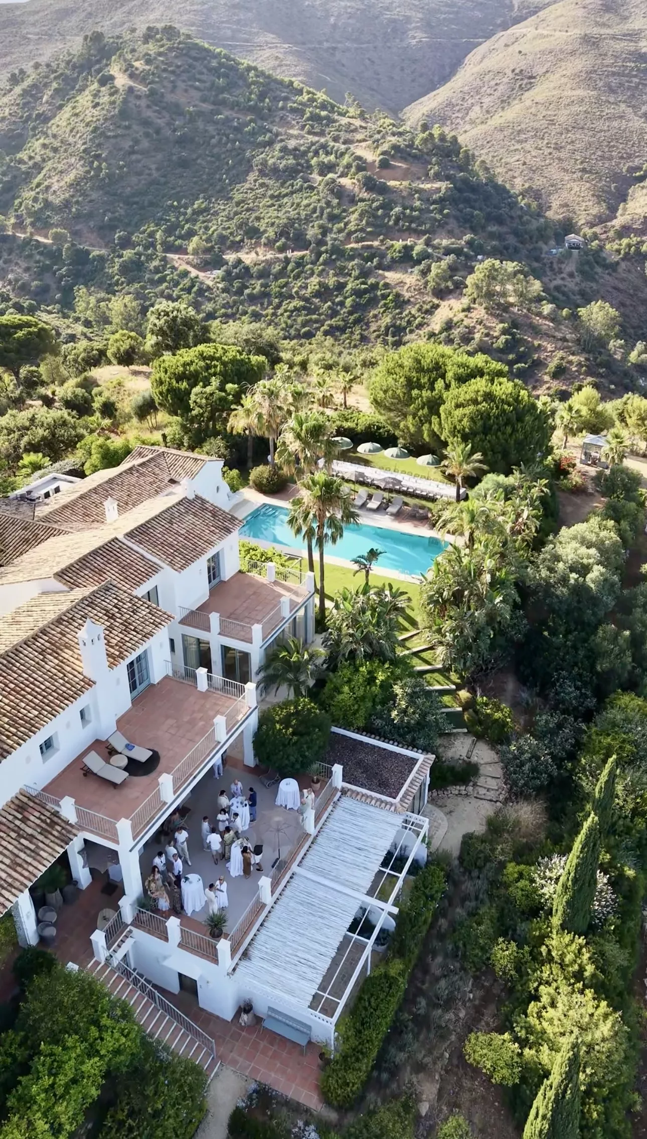Aerial drone view of a private villa wedding venue near Marbella with pool and mountain backdrop