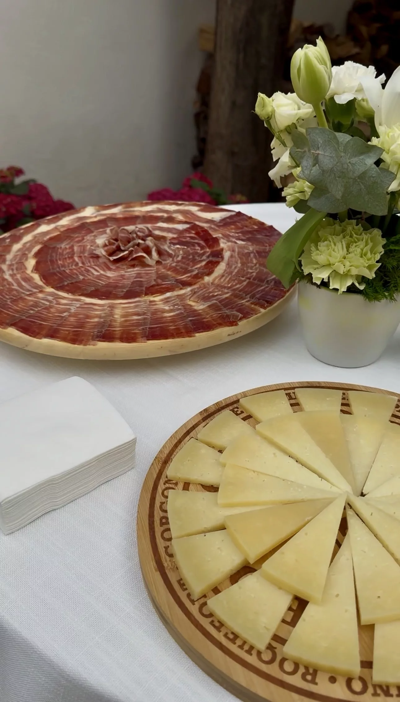 Freshly sliced Iberian ham and aged cheese served at a Campo Marbella wedding aperitif