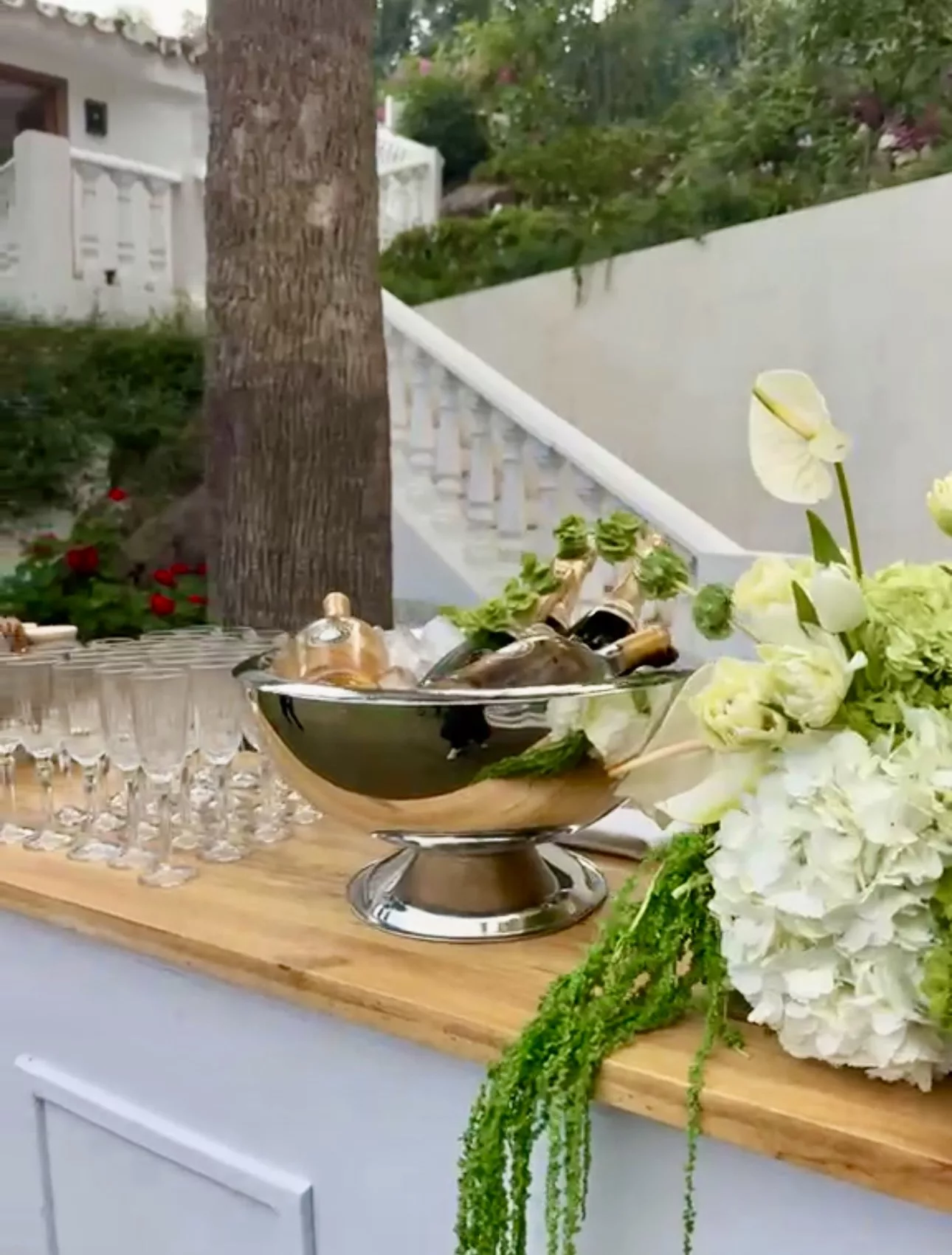 Champagne flutes and silver ice bucket with Cava at a Campo Marbella wedding aperitif bar
