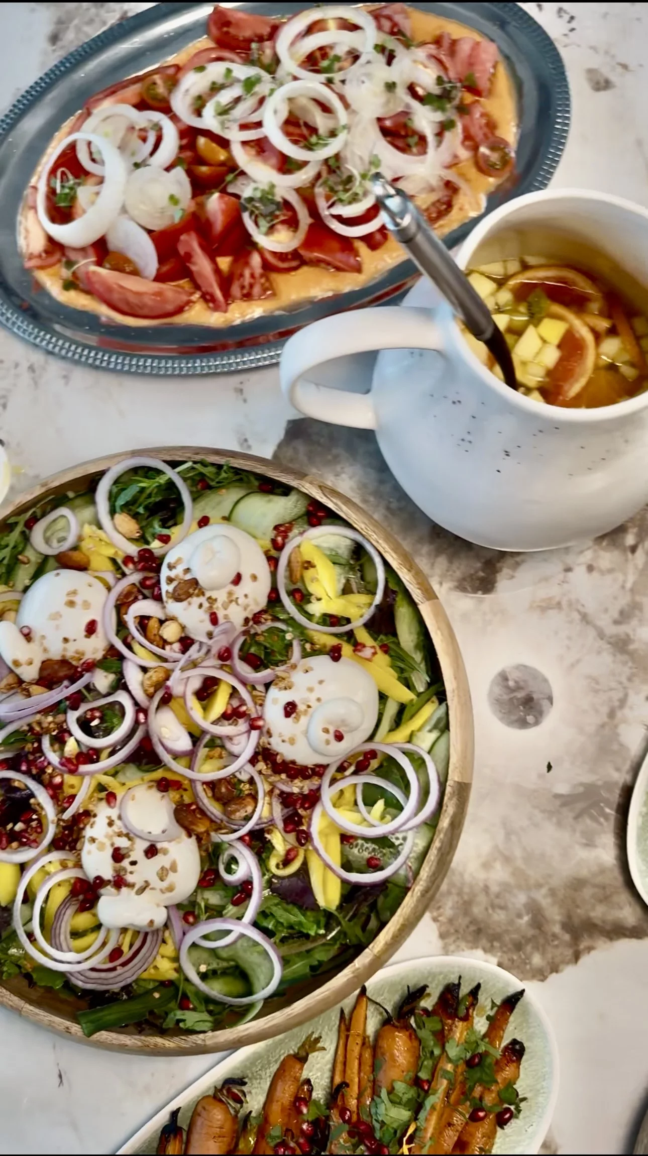 Overhead seasonal salads including burrata and tomatoes at a Campo Marbella BBQ wedding
